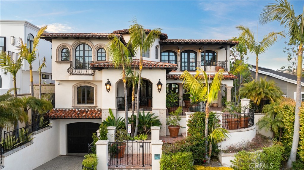 Nestled in the heart of Corona Del Mar, this captivating Mediterranean Residence offers an unparalleled lifestyle with breathtaking panoramic ocean, Catalina Island, Pelican Hill Golf, and Buck Gulley views. This exquisite home features 7 bedrooms and 8 bathrooms, wide open foyer with glass skylight ceiling, gourmet kitchen with stainless steel appliances, upgraded sound and security system throughout the house. The basement include a rare additional 2100 square feet of finished garage. Entertainment abounds with a large 18’x36’ infinity pool with water fall and spa with a pool bath and outdoor shower. A 2-hoop basketball court and abundant room for a regulation pickle ball court. Private access to gated beach area, walking distance to the vibrant CDM Village, renowned plazas, and close to top-rated schools.
!