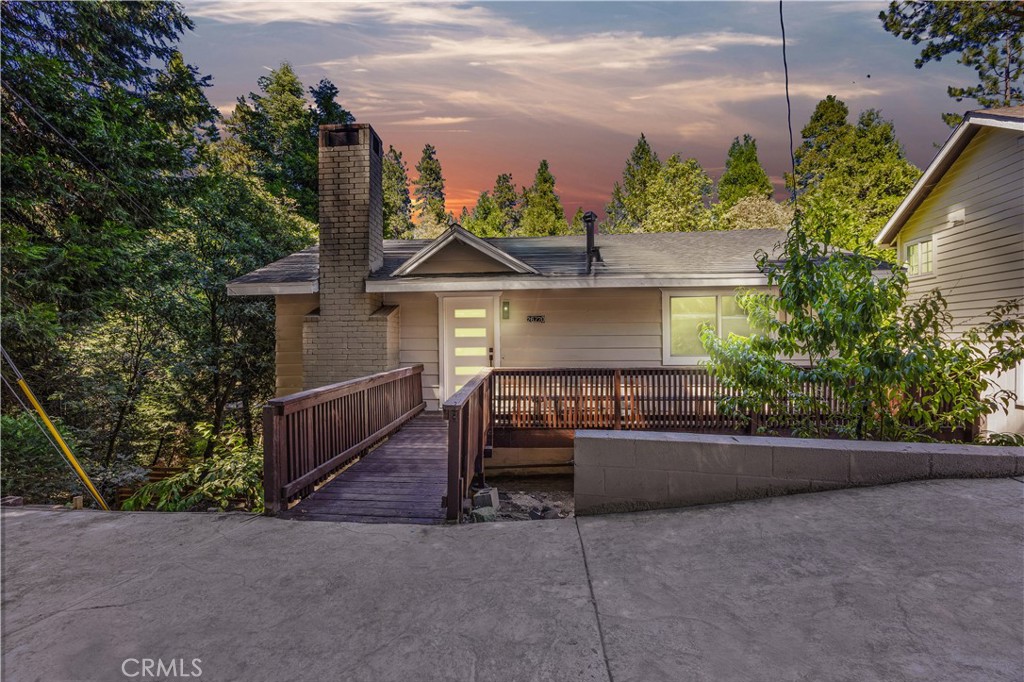 !Open House Saturday 7/26 2pm-5pm! Nestled in the tranquil mountain community of Twin Peaks, 26770 State Highway 189 offers a perfect blend of modern comfort and natural charm. This beautifully updated home features a stylish interior with high ceilings, all-new appliances, a large quartz kitchen island with custom European style cabinets, and a cozy wood-burning fireplace. The versatile layout includes a bonus room and a very generous walk-in closet in the primary bedroom. Step outside to enjoy three expansive decks, perfect for entertaining or simply taking in the serene surroundings. Set on a large, fenced lot with no neighbors to the left, just trees, birds, and the occasional bear cub, this property offers unmatched privacy and peacefulness. A private driveway provides ample parking, and you’re just a short 10-minute drive from both Lake Gregory and Lake Arrowhead. This is truly a must-walk property to fully appreciate the space, setting, and character it offers. Whether you’re looking for a full-time residence or a mountain getaway, this home delivers the best of both worlds. Schedule your private showing today! Some photos have been electronically staged.