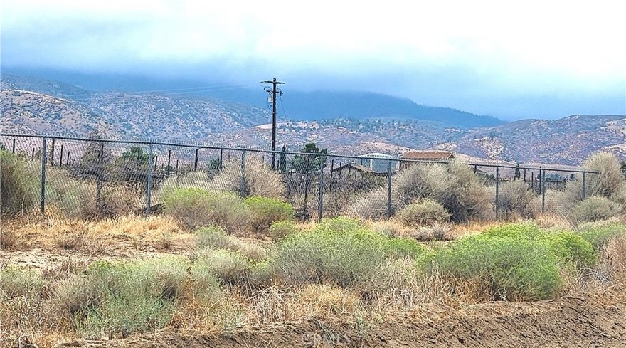 Beautiful Lot! 10acres at 183rd St West and Avenue F in Fairmont area. This great ranch is fully 5feet chain link fenced. 3 feet fence is installed separately inside to prevent prevent animals from entering. Own well with 10,000 gallon water tank , power and approx. 1,600 grape vines with installed dropper. Spring cooler system installed on 3acres, making it suitable for farming. 2 sheds ( 10x12), 7 storage ( 10X12), 10 vinyl house 9 ( 7x10) 1( 7x30) Much future potential !! Must See!!