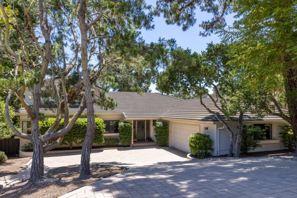 Welcome to Skyline Ridge Estates, a favorite Monterey neighborhood known for its peaceful setting and convenient location. This spacious home offers over 3,000 sq. ft. of living space with a flexible layout that includes two primary suites, adding convenience for guests or multi-generational living. The open kitchen and classic wet bar make entertaining easy, while two fireplaces add warmth and charm. Newer flooring and paint complement the comfortable floorplan. Outside, enjoy a private deck and low-maintenance yard. You'll appreciate the peace and privacy of this setting with all the beauty and convenience of the Monterey Peninsula just moments away.