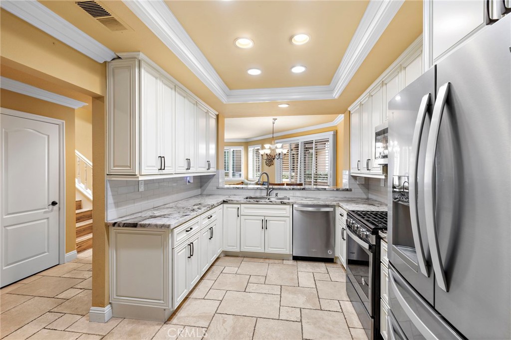 Seller will entertain offers from $999,999 - $1,050,000 - Three full bedrooms, Three full baths, Two Garages, Indoor Laundry
Welcome to a home that is more than a residence — it’s a lifestyle. Tucked inside the prestigious gated community of Lake Forest, this beautifully reimagined three-bedroom, three-bath retreat offers nearly 1,928 square feet of refined living, seamlessly blending elegance, comfort, and modern convenience. With two garages, an interior laundry room, and exclusive access to the Lake Forest Tennis Club, this property truly checks all the boxes.
From the moment you step inside, soaring cathedral ceilings, skylights, and walls of windows flood the home with natural light, illuminating fresh designer finishes throughout. Every detail speaks of sophistication, from the travertine floors and crown molding to the striking marble countertops and high-end natural stone accents. The bathrooms feel like private spas, designed with timeless basket weave tile, dual shower heads, and luxury finishes that turn everyday routines into indulgent rituals.
The gourmet kitchen is both a showpiece and a gathering space, featuring stainless steel appliances, custom cabinetry, and dramatic marble surfaces that make entertaining effortless. Open living and dining areas flow naturally to a covered patio, while the private balcony off the primary suite invites quiet mornings with coffee, sunset views, and tranquil evenings.
Just steps from your door, enjoy the shimmering pool and serene lakefront — where mornings begin with dew rising off the water and end with the peace and beauty only lakeside living can offer. Inside, thoughtful upgrades abound: recessed lighting, new windows, plantation shutters, and fresh paint create a move-in-ready environment with lasting appeal. The versatile layout with two master suites and a flexible guest room provides both comfort and options for modern living.
Life on Jasper Lake Lane means more than just a home — it’s resort-style living every single day. Take advantage of sparkling pools, tennis courts, lake access, and a private clubhouse complete with a newly renovated lagoon. Here, every day feels like a getaway.
This is more than a house. It’s a sanctuary of beauty, comfort, and inspiration — a rare opportunity to own not just a home, but a way of life.