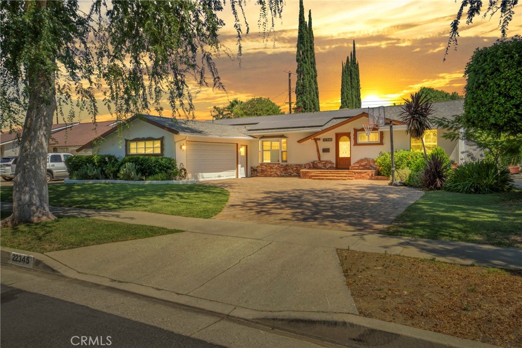 Welcome to your dream home in Canoga Park! Tucked away on a peaceful cul-de-sac, this beautifully renovated 4-bedroom, 2-bathroom residence blends modern comfort with thoughtful upgrades and an entertainer’s lifestyle. As you step inside, you’ll be greeted by the warmth of newly upgraded flooring that flows throughout the home. The open-concept layout features a stunning chef’s kitchen with top-of-the-line stainless steel appliances, ample cabinetry, and elegant finishes. Perfect for hosting or daily cooking with ease. This home is designed with sustainability and efficiency in mind, offering fully paid-off solar panels and a Tesla charger, providing long-term energy savings and a forward-thinking lifestyle. The spacious primary suite offers a serene retreat, while the additional bedrooms are perfect for family, guests, or a home office setup. Step outside to discover a private backyard oasis, ideal for relaxing or entertaining. The lush, low-maintenance turf keeps the space looking pristine year-round, while the custom fire pit area sets the stage for unforgettable evenings under the stars. For those who enjoy farm-to-table living, the yard also features fruit-bearing trees—a perfect touch of nature that enhances the charm and functionality of the space. Conveniently located near parks, shopping, dining, and so much more, this home offers an unbeatable blend of style, comfort, and lifestyle convenience. Don’t miss this exceptional opportunity-move-in ready, energy-efficient, and priced to sell home!