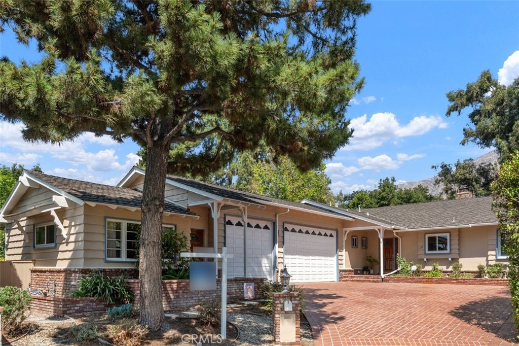 This beautiful home is nestled on a peaceful cul-de-sac in highly sought-after North Arcadia. The stunning south-facing single-story layout offers an exceptional blend of comfort, function, and space. Located near award-winning Arcadia schools, this well-maintained residence spans approx. 2,700 sq ft and features 4 bedrooms and 3 bathrooms, thoughtfully upgraded for modern living. Recent updates include owned Solar panels, a Newer roof (2021), and Dual-pane windows (2021). Inside, bright living and family rooms boast hardwood floors, gas fireplaces, recessed lighting, and a vaulted ceiling with fan in the family room. The Updated kitchen features tile floors, custom wood cabinetry, a 5-burner gas cooktop, and stainless steel appliances, including a 2022 LG fridge, KitchenAid oven, Whirlpool microwave, 2023 dishwasher, and a 2023 in-kitchen washer. A spacious game room opens to the backyard through oversized sliders—perfect for indoor-outdoor entertaining. With a wet bar, wood-paneled ceiling and walls, and a classic rec-room feel, it includes a pool table and ping pong setup. The private bedroom wing includes a primary suite with a remodeled en-suite bath with quartz countertops and tile flooring. A full hallway bath and a 3/4 bath—accessible from the yard and pool—have also been updated. One bedroom connects directly to the game room.
An attached 4th bedroom suite with its own entrance is connected to the 3-car garage and offers potential as an in-law suite, private office, gym, or ADU. The oversized garage features soaring ceilings, built-in storage, a sliding partition, a finished attic with ladder, and rear yard access. Outside, enjoy a sparkling pool, expansive yard, and a long driveway with parking for up to 5 cars—including RV potential. A detached bonus guest house attached to the garage includes a living area, ¾ bath, closet, ceiling fan, A/C, and subpanel—ideal for flexible living or income. Additional features include central A/C and heat with two units, newer water heater, multiple yard access points, and abundant storage. Conveniently located near a dog park, YMCA, basketball courts, playgrounds, hiking trails, the Arboretum, Westfield Mall, and the 210 Freeway.
This rare, thoughtfully upgraded home in one of Arcadia’s most desirable neighborhoods won’t last long—don’t miss it!
