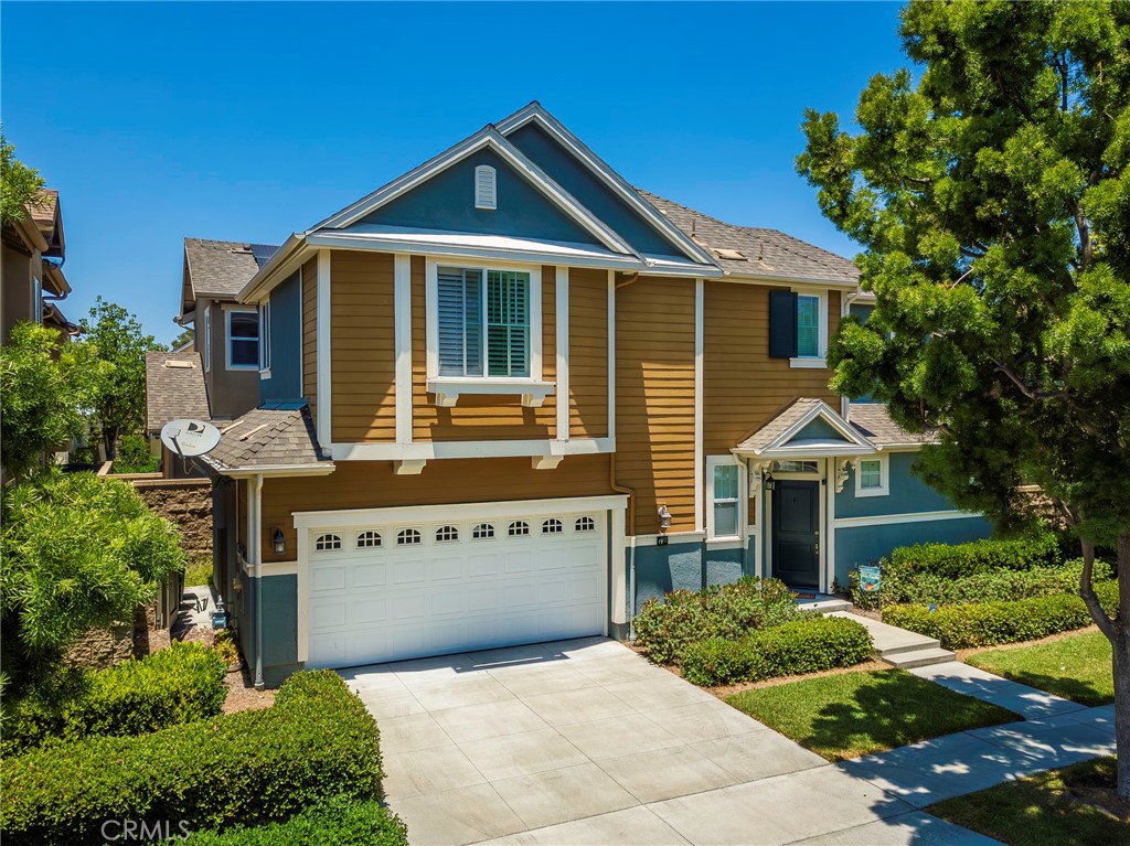 Discover your dream home at 72 Westwind Drive, a captivating detached residence nestled in Tustin's highly sought-after Tustin Fields 1 community. This home seamlessly blends contemporary style with inviting charm, all within the esteemed Irvine Unified School District. Be captivated upon entry by dramatic high ceilings, fresh new interior paint, an abundance of natural light, and new elegant laminate flooring that graces the entire main level. The open-concept living and dining area provides the perfect setting for relaxation or entertaining, centered around a warm and inviting fireplace. The kitchen is a culinary delight, showcasing white cabinetry, Corian countertops, and black and stainless-steel appliances, complemented by new recessed lighting and a welcoming breakfast bar – sure to be the heart of your home. Upstairs, new carpet guides you to the expansive master suite, a true retreat, featuring dual sinks, a luxurious sunken tub, a separate glass-enclosed shower, and an enviable walk-in closet. Two additional well-appointed bedrooms with large closets, ceiling fans, plantation shutters and custom bamboo shades, ensuring comfort and style. Step outside to your private outdoor sanctuary, complete with an expansive patio with ceramic tile, creating the ideal space for memorable summer cookouts and delightful al fresco dining. Additionally, 2 car attached garage with drive way parking. The Tustin Fields 1 community elevates your lifestyle with resort-style amenities including a sparkling pool, clubhouse, park, playground, and sports courts. You'll also love the unbeatable convenience of being just minutes from The District's endless array of shopping and dining. Embrace the vibrant community spirit and don't miss this exceptional opportunity!