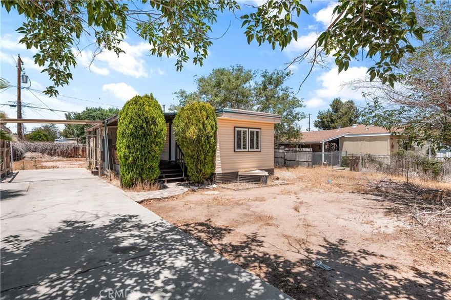 Welcome to this beautifully updated manufactured home in Hesperia where you own the land—no space rent or HOA fees! Situated on a spacious 7,200 sq ft lot, this property offers both freedom and functionality. Inside, you'll find brand new flooring throughout, adding a fresh and modern touch. The kitchen shines with sleek quartz countertops, stainless steel appliances, and plenty of cabinet space—perfect for home-cooked meals and entertaining. With ample outdoor space and room to grow, this home is a rare find in a sought-after location. Don’t miss your opportunity to own a turnkey property.
