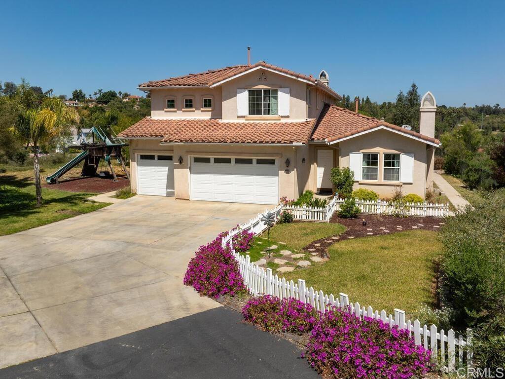 Homes in the Mission Oaks neighborhood rarely come on the market. Beautifully maintained neighborhood. Rural and serene area of Fallbrook with amazing breezes hidden away in a cul-de-sac. This could be a fit for multi-generational living. Not only is there a primary bedroom/bathroom located on the first floor there is also a primary bedroom/bathroom upstairs. A total of three oversized bedrooms upstairs with a loft area that has a built in desk for school work or running a home business. Kitchen is open to the family room for easy entertaining. French doors lead you to the backyard where you could install raised planter beds to grow your own garden and satisfy your gardening hobby. Two fireplaces, one in the family room and one in the living room. High ceilings, ceiling fans, inside laundry room and a 3 car garage for extra space. Located close to shopping, dining, tennis club, sports park, Fallbrook air park and the beautiful Los Jilgueros preserve. Low HOA fees.