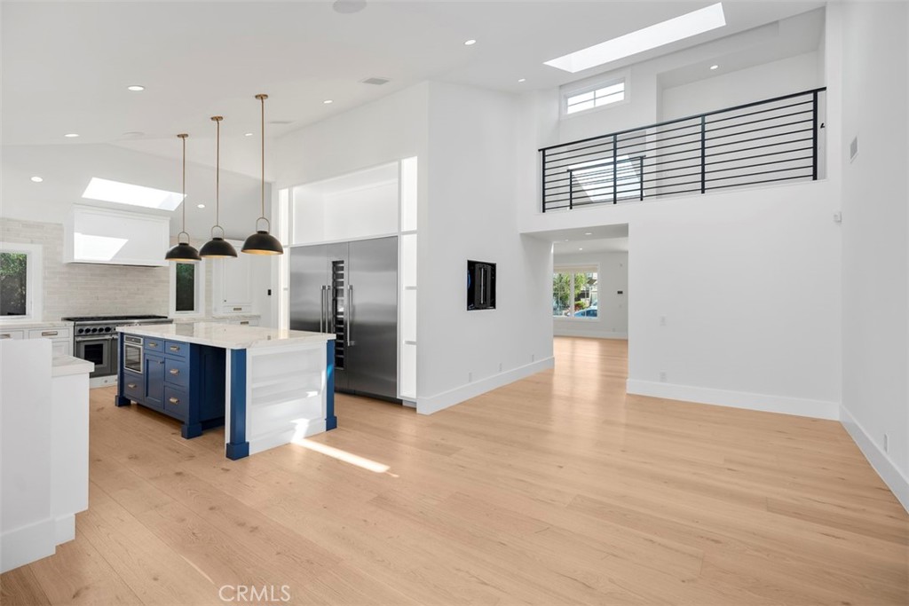 CUSTOM, TURN KEY, DOWN TO THE STUDS renovation in the heart of Newport Beach. This stunning and modern coastal residence is ideally situated in one of Newport's most sought after neighborhoods "The Port Streets". A quick 5 min walk to HIGHLY desirable Anderson Elementary and 5 minute drive to beaches in Corona Del Mar and Newport Coast. This turn key home harmoniously blends contemporary aesthetics with Feng Shui principles, creating an environment of optimal energy flow and abundant natural light. The spacious interior boasts 5 bedrooms and a loft, (primary and 1 guest bedroom on main floor) 3.5 bathrooms. High ceilings, expansive windows, and white oak flooring enhance the inviting atmosphere, while top-of-the-line finishes add a touch of luxury. For your convenience, the property is equipped with high-tech features such as keyless entry, an automated "Savant" system, surround sound, and dual-zoned heating/air, and motorized and black out curtains. The kitchen is a gourmet's dream with upgrades including a touch-less faucet, Thermador refrigerator, freezer and wine unit. The outdoor space is an entertainer's paradise, featuring a Jacuzzi with smart system control, a pool, and custom fire place and grill island. A short stroll away, you'll discover a community clubhouse, pool and spa, and open field for outdoor activities. The Harbor View neighborhood is zoned for the many award winning schools; Anderson Elementary, Corona Del Mar High School and minutes away from TVT and Sage private schools. Offering plentiful amenities, a community feel, and close proximity to the beach, Fashion Island mall, top restaurants, resorts and more. 1954 Port Locksleigh is more than a home; it's a sanctuary where modern convenience meets timeless design, promising a unique living experience in a welcoming community. Don't miss the opportunity to make this extraordinary property your new home