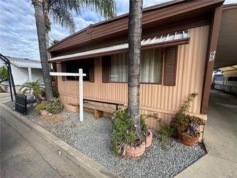 Located in the desirable city of La Verne, this beautifully maintained 2-bedroom, 2-bathroom mobile home offers 1,100 square feet of comfortable living space with tasteful upgrades throughout. Step inside to find a bright and open layout featuring updated flooring and an inviting living area perfect for relaxing or entertaining.
The kitchen boasts modern touches with upgraded countertops and ample cabinet space. Both bedrooms are generously sized, with the primary suite offering a private en-suite bathroom and a large closet. The second bathroom is equally well-appointed, making it ideal for guests or family.