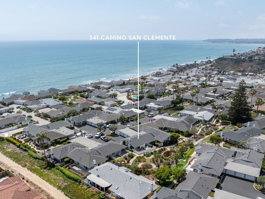 Welcome to a rare find in the heart of San Clemente’s beloved 55+ Colony Cove community — a completely remodeled mid-century beach cottage designed by renowned architect Chris Abel. Set just moments from the ocean, this home offers the best of laid back coastal living with thoughtful upgrades and timeless design.
Soaring 14-foot cathedral ceilings with exposed wood beams set the tone as you enter the home, where peek-a-boo ocean views provide a picturesque backdrop to an open floor plan designed for easy living. The living room is anchored with a custom floor-to-ceiling fireplace clad in forged black steel and tempered glass. Indoor-outdoor flow leads to a serene patio oasis with a waterfall-fed stream and lush garden views — your own private slice of nature.
The kitchen is a true showstopper, featuring quartzite countertops, a handcrafted English farmhouse sink, Bosch appliances, and soft-close cabinetry. The Dutch door, pendant lighting, and porcelain wood-look tile add charm and durability throughout. Both bedrooms include custom barn doors, ceiling fans, and California Closets build-outs completed in 2024.
Additional upgrades include a tankless water heater, Milgard windows throughout, updated electrical and plumbing, newer furnace, and newer garage roof and door. HOA has recently completed exterior painting, and the home is surrounded by beautifully maintained pathways that lead directly to the Sea Summit Trail and beaches. Located ideally between Dana Point and San Clemente, this community offers easy access to PCH and a paved bike trail extending four miles along the coast. Welcome to the ideal California coastal lifestyle.