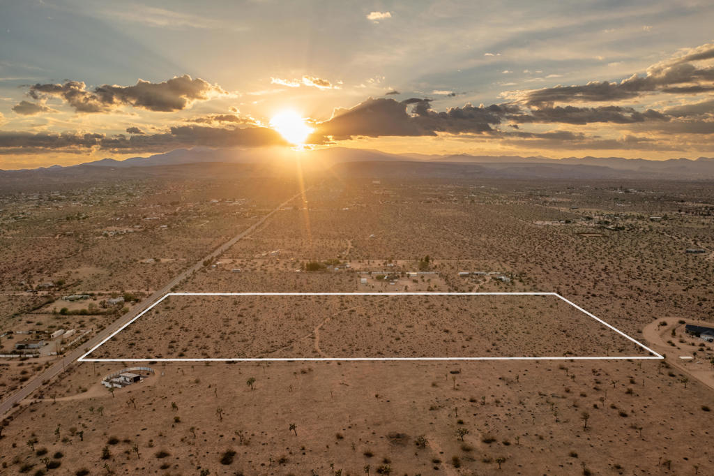 Here's a great opportunity to secure an impressive 20-acre parcel in one of the desert's most desirable settings. Perched on the Mesa, this expansive property delivers sweeping views and a location that blends privacy with convenience. The land is dotted with beautiful, mature Joshua Trees, spaced to preserve the natural beauty while still allowing ample room for future development. Whether you're envisioning a private desert sanctuary, a custom estate, or exploring subdivision opportunities, this parcel provides the flexibility to bring your vision to life. Zoned HV/RL-5, it allows for multiple options depending on your goals. Easily accessible right off Aberdeen Dr., a paved road, and with utilities nearby (buyer to verify), this property makes for an ideal balance of seclusion and accessibility. Large parcels in this location are increasingly rare--and at this price, it's an exceptional opportunity you won't want to miss!