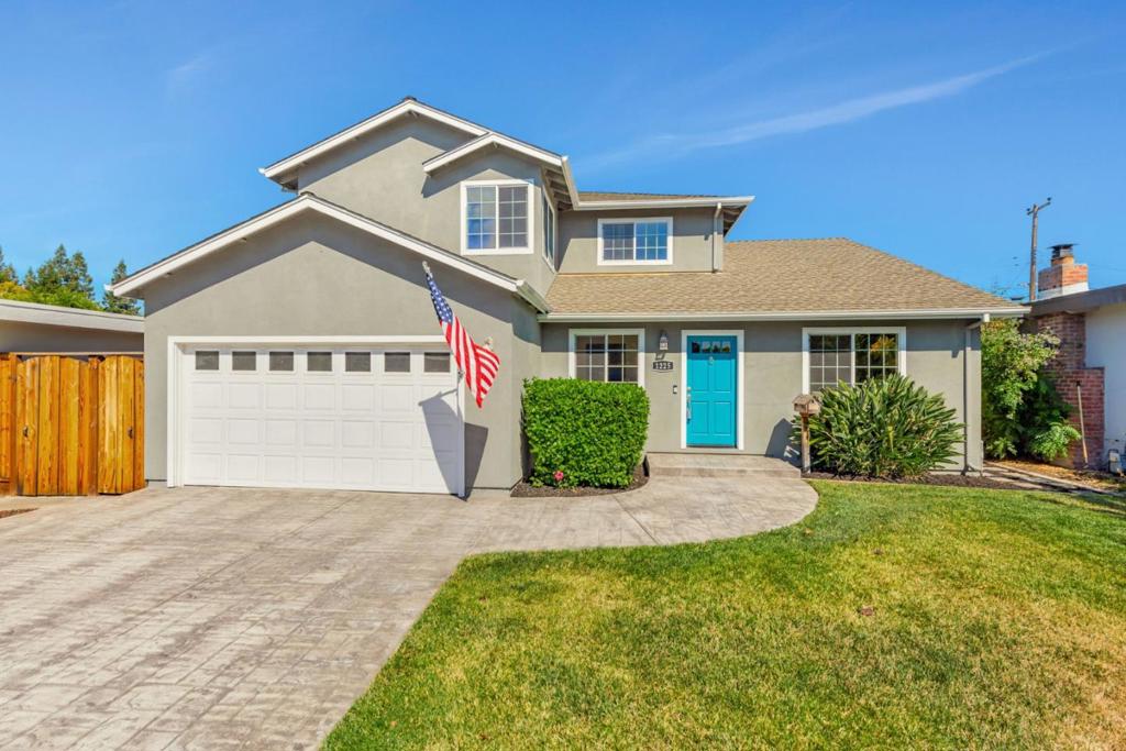 Discover the perfect blend of comfort, space, and convenience in the heart of Silicon Valley. This beautifully designed 4-bedroom, 3-bathroom home offers 2,929 Sq. Ft. of thoughtfully updated living space. Enjoy a spacious living room with hardwood floors, crown molding, recessed lighting, and clever storage under the stairs. The inviting family room features a cozy gas fireplace, while the kitchen impresses with quartz countertops, deep sink, bar seating, and stainless steel appliances including a gas range and dishwasher. With two primary suites, one on each level, each featuring jetted tubs and ample closet space, you'll enjoy ultimate flexibility and comfort. The upstairs bonus area is perfect for a home office, recreation, or relaxation with scenic mountain views. Outside, a low-maintenance backyard, covered patio, and dual-side access offer great outdoor living. Additional features include inside laundry, dual-zone heating & A/C, double-pane windows, and abundant storage. All of this just minutes from major tech campuses like Apple and Nvidia, top shopping, dining, and easy freeway access.