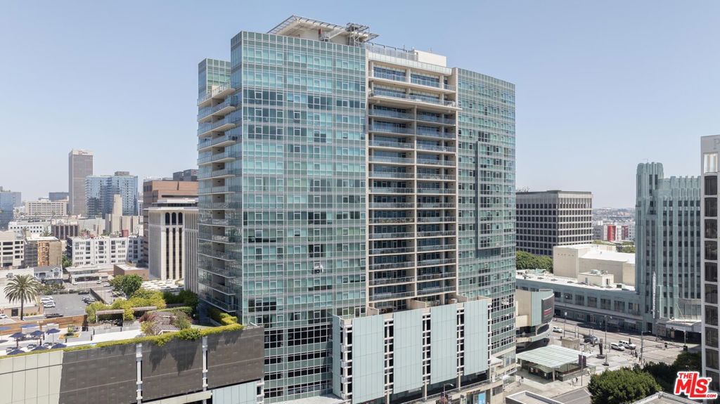 Welcome to Solair, a premier high-rise residence located in the heart of Koreatown at the iconic intersection of Wilshire and Western. This bright and spacious 2-bedroom, 2-bathroom unit on the 8th floor features panoramic west-facing city views through floor-to-ceiling double-pane windows. The open-concept layout includes hardwood floors throughout, a modern kitchen with Bosch stainless steel appliances, Caesarstone countertops, and in-unit laundry. The primary suite offers a large closet and a luxurious en-suite bath. Additional highlights include central A/C and heating, and side-by-side parking on the 5th floor. Residents enjoy resort-style amenities such as 24/7 concierge and security, pool, spa, private cabanas, a state-of-the-art indoor/outdoor fitness center, a business lounge, conference room, large dog park, and direct access to the Purple Line Metro. Just minutes from The Grove, Beverly Hills, Larchmont Village, CGV Cinemas, and the Wiltern Theater, this residence offers a rare opportunity for luxury urban living. HOA dues include water, trash, and access to all building amenities. Unbelievable price for Solair. Don't miss out on this great opportunity.