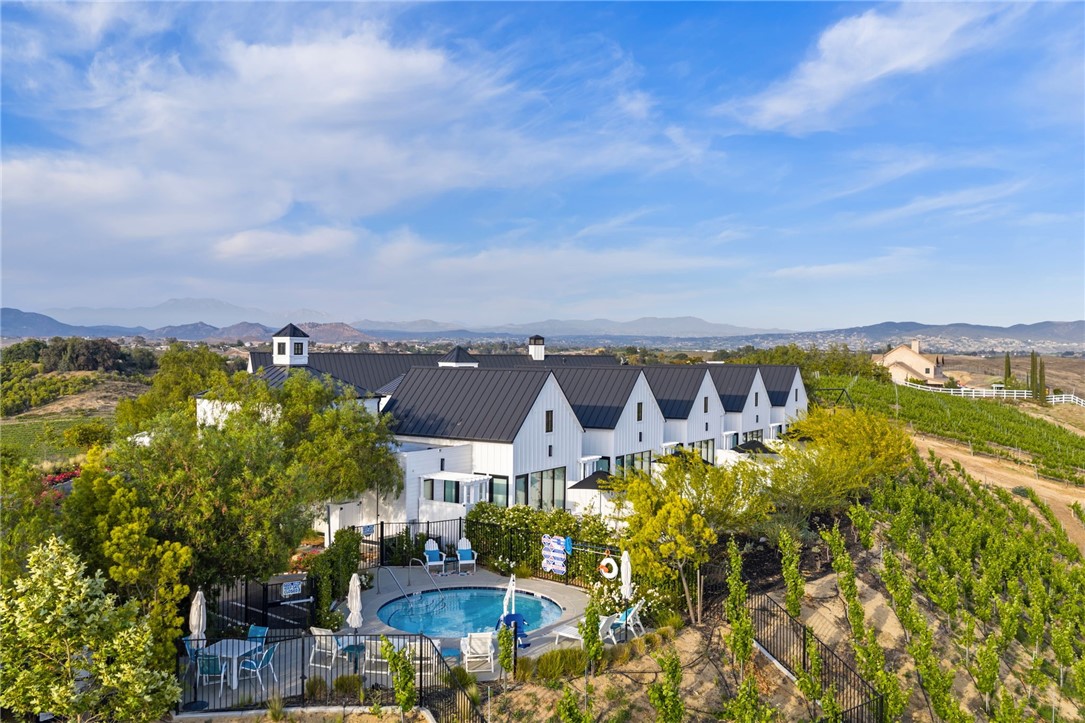 Welcome to The New Inn - The most beautiful and elegant Inn in the Temecula Wine Country. The New Inn is a purpose built "Cottage Inn", and enchanting oasis, which is fully approved and permitted by the County of Riverside. A "Cottage Inn" contains 5 Rental Villas, plus an Owner's Residence. The New Inn was the first and is the finest Cottage Inn that has been constructed in the Temecula Wine Country, and has developed a well deserved reputation as the premier Inn in the Temecula Valley! The entire property is beautifully perched on the top of a gentle knoll providing expansive views of the surrounding vineyards, and its location close to everything is perfect. Built in 2018, on 4.6 Acres, this spectacular property features 5 individual Villas plus a dramatic "Owner's Residence". Each Villa is uniquely and elegantly decorated with top quality furnishings and fixtures, with full wall windows. With over 625 sf in each Villa, and 16' ceiling, they are extremely spacious with King sized beds. There are large private bathrooms with @Walk-in showers, each with a large separate soaking tub, and double vanities. Additional amenities include - wet bar with Nespresso Coffee machine, refrigerator, Sony smart 4K TV, private patio with vineyard views, fire pit, and outdoor walk-in Rain Shower! There is a pool for guests. The total square footage of the Villa portion, including the reception areas, laundry room, hallways, additional 1/2 bath and welcome area totals over 4,733 sf. The exceptional Owner's Residence contains 3,600 sf - with Great Room with 20' high ceilings, Huge Primary Suite, secondary bedroom, and 2.5 baths. There is a large private pool and spa with BBQ and gas fireplace, elegant covered patios. The elegant gourmet kitchen features quartz counters, decorator tile backsplash, 66" Viking Tuscany Line Range with 8 burners, with matching hood, Two Viking Tuscany Line dishwashers, 18" Column Sub Zero dual zone wine refrigerator, a 54" Sub Zero Refrigerator/Freezer, Wolf Steam Oven, Wolf Microwave Drawers, Wolf Built-in Coffee/Espresso maker, Wolf Built-in Mug Warmer. The huge Center Island with Breakfast Bar seating for 6, plus the dining room table offers seating for 8. The family room area is spacious with, a fireplace, and views over the Vineyard and there is an attached 2 Car Garage.