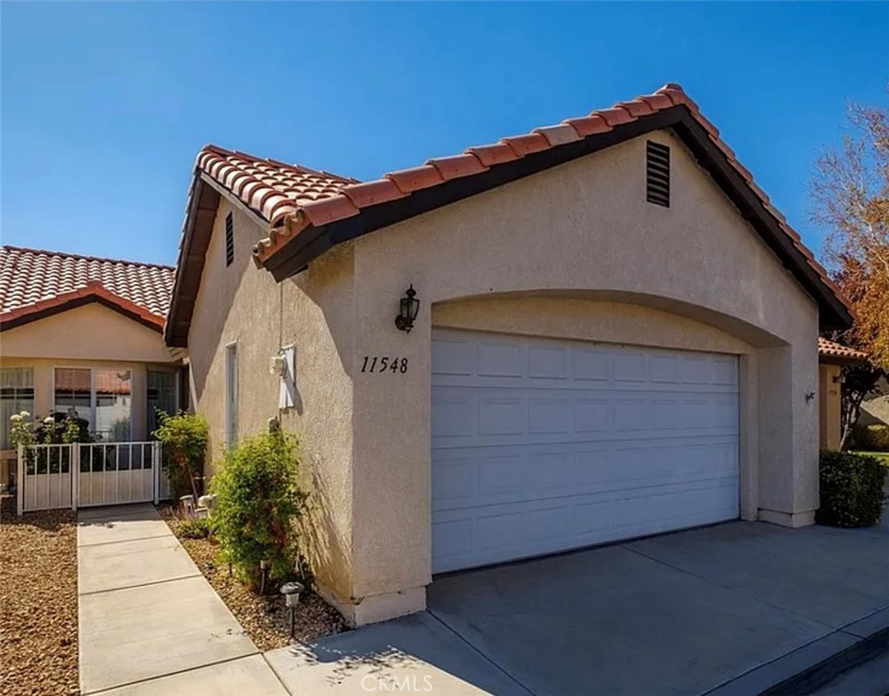 55+ home in the Jess Ranch Community. Front and back patio areas. Sunny kitchen with breakfast nook, white kitchen cabinets, refrigerator and a dishwasher. Ornamental fireplace in the living room. Second bath has a walk-in shower. There is a laundry closet in the hallway which includes a washer and dryer. Two car garage.