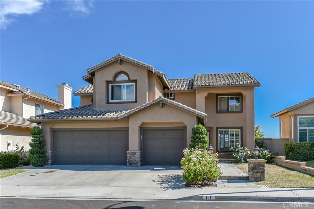 SPECTACULAR VIEWs of Ocean, City Lights and Catalina Island in the charming hillside community of Foothill Ranch. Five bed three bath plus one loft, located in a prime cul-de-sac lot on a quiet street. Recent upgrade with total spent over $88,000. Fully new remodeled kitchen with brand-new white shaker cabinets/quartz countertops/ appliances / new heater. All bathrooms upgraded with brand new vanities and quartz countertops. Brand new vinyl plank flooring throughout. This home features a desirable bedroom and full bath downstairs, Four bedrooms and three full bathrooms plus a large bonus room upstairs, and an attached 3-car garage with spacious overhead shelves. The gourmet kitchen opens to the backyard patio with tremendous evening city lights. Enjoy indoor/outdoor dining, and the formal living room & dining rooms exquisite interior architecture. The family room has customized built-in media center with bookcases and a gorgeous fireplace with custom rod iron gate. Master Suite offers vaulted ceilings, dual vanities, spacious walking closet, and spectacular Catalina views. This beautiful home also offers upgraded crown molding, baseboards, plantation shutters, dual panel windows, ceiling fans, recessed lights, and more. And ideally located near the Blue-Ribbon Elementary School, local restaurants, shops, hiking and biking trails, community pool, parks, 241 toll roads, the 5 Freeway, and Irvine Spectrum Center. Low Tax! Low HOA Fee!