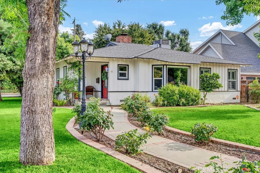 Nestled in Visalia's highly sought after Beverly Glen neighborhood, this beautifully maintained vintage home effortlessly blends timeless elegance with modern conveniences. Once used as an Airbnb, this property features 2 spacious bedrooms, 2 bathrooms, 2 living rooms, and a den/office, this home offers ample space and charm. The updated kitchen is a chef's dream, complete with updated countertops, abundant storage, high-end appliances, a double oven, 8-burner stove, a built-in refrigerator, and a reverse osmosis system, while the cozy breakfast nook with bay window invites you to enjoy peaceful morning views. Both living rooms are enhanced by warm fireplaces, perfect for relaxation. The formal dining room showcases lovely built-ins, and the large bay window in the living room floods the space with natural light. Plantation shutters throughout add a touch of sophistication. A whole house fan provides energy-efficient comfort and a solar system adds to the home's efficiency. The backyard is an entertainer's paradise, featuring a covered patio with a charming fountain, a small garden, and plenty of room for outdoor enjoyment. From the original hardwood floors that have been beautifully refurbished, to the elegant stained glass double doors leading to the backyard, every detail of this home has been thoughtfully cared for. Truly a must-see!