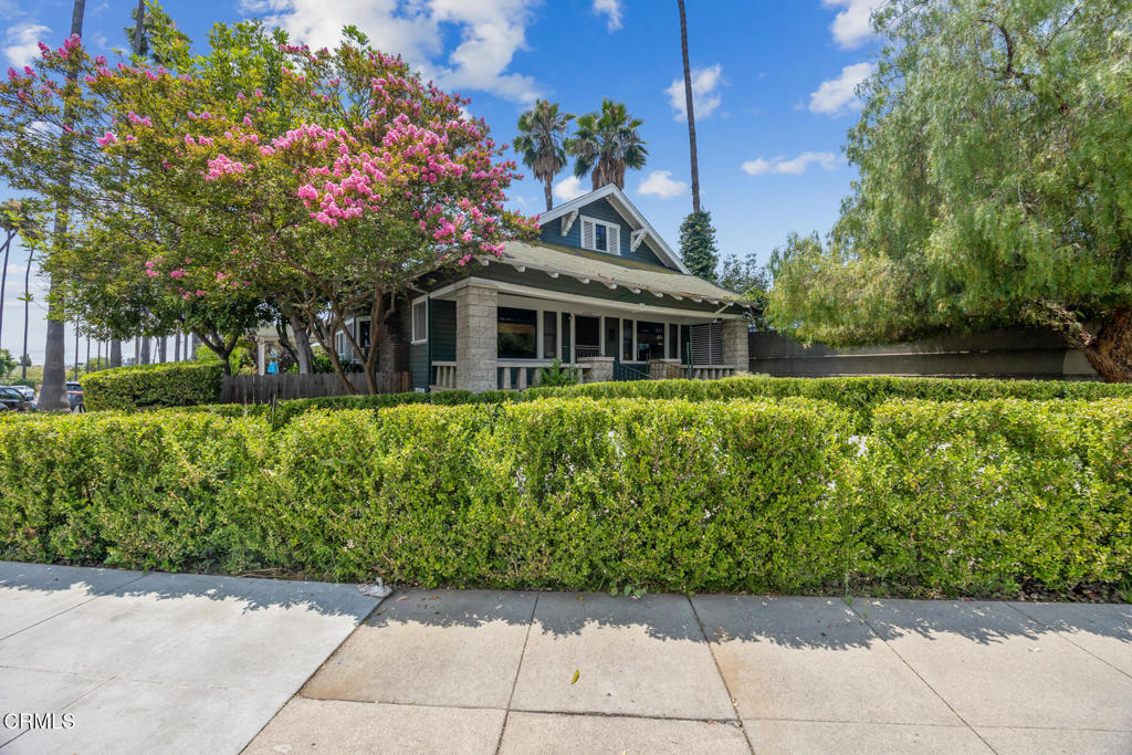You never know what will be behind a front door. Walking through this front door will take you back in time. The beautiful box beamed ceilings, stunning fireplace and fantastic built-in in the den/dining room area, not to mention the original hardwood floors, all harken back to the origins of Southern California. In your mind, you breathe in the orange blossoms and imagine a different time. The rooms are gracious with a very easy floor plan. The kitchen gets wonderful light and offers a sweet eating area as well, with the side door opening onto Primrose. The back yard is simple, sweet and private with plenty of room to enjoy on our amazing SoCal weather.