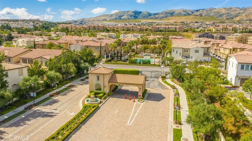 Located in the highly desirable gated Seville community, this spacious two-story townhome offers 4 bedrooms and 3 bathrooms with a thoughtful floorplan. The main level features a bright living room, dining area, and a gourmet kitchen with granite countertops, pantry, and stainless steel appliances, including a stove/oven, microwave, trash compactor, washer, and dryer—all included for your convenience. A bedroom and full bath on the main level provide flexibility for guests or a home office. Upstairs, the master suite boasts a walk-in closet and a full bath with dual sinks. You’ll also find Two additional bedrooms, lots of storage/linen cabinets in the hallway, and a convenient upstairs laundry room. Enjoy your private patio surrounded by lush landscaping, perfect for outdoor relaxation. The home also includes a 2-car garage.Residents have access to HOA amenities such as a sparkling pool, spa, playground, and BBQ area. Conveniently located near the 118 Freeway, Vineyard Shopping Center, restaurants, hospital, Whole Foods Market, and within the sought-after Porter Ranch Community School (K–8) boundary.