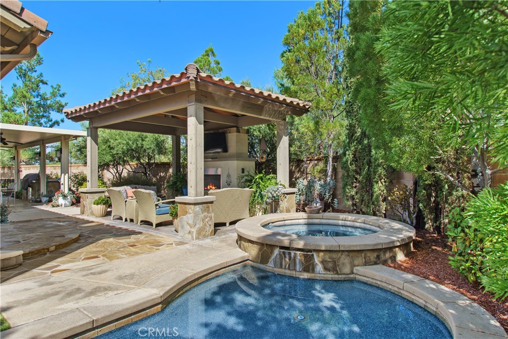 Look no further! Welcome to your new Paseo del Sol home in The Reserve! A custom solid core Iron Door welcomes you into the private courtyard area & as you enter into this elegant home your attention is drawn to an inviting open floor plan. The Formal Dining room is tastefully designed and, as you walk into the expansive great room, complete with gas fireplace, crown molding, built in entertainment center, upgraded flooring and a ton of windows, you know this is the home for you! The design of this home highlights the casual California lifestyle by blending the kitchen into the sensational Great Room, for the open concept that is so highly sought after. You will love the enormous island, granite countertops, stainless steel appliances, 2 pantries, Lighted glass cabinets & discover each room is packed with PIZZAZ! Combine these features with high ceilings, recessed lighting, additional windows, plantation shutters and custom window treatments, additional office with outdoor entry, solar & you have the Quintessential for easy entertaining. The convenient guest Bedrooms & Bath are perfect for a Next Gen Home, offering privacy for guests. There is a huge office, with built in cabinets and can easily be converted to a 4th bedroom. The Primary BR is very bright & airy & the attached BA includes a large walk- in closet, luxurious, deep soaking tub, oversized shower, vanity, dual sinks & tons of windows. Completing this package is the, 10,000 + SF lot, offering turf landscaping, a private & tranquil atmosphere, soothing pool and spa and outstanding Outdoor Pergola with fireplace and TV, plus built in BBQ for easy entertaining! The magnificent mature landscape, vinyl and block fencing & steps away from the park, plus close proximity to the schools makes this one your most Important Appointment in Years to see! Community amenities offer 3 swimming pools, clubhouse, exercise room, meeting room, walking trails, tennis courts & Temecula Wine Country is 5 minutes away! We welcome your consideration of ownership in this stylish, Single Level home!