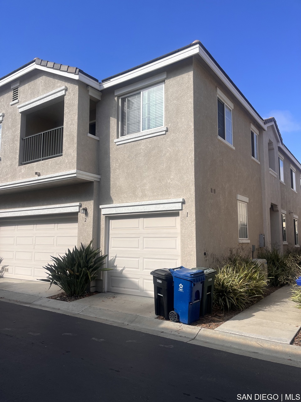 This beautiful 2 bedroom, 2 bathroom corner unit townhome in the heart of Otay Ranch offers the perfect balance of comfort, style, and convenience. From the moment you arrive, you'll notice the easy access walkway leading to the front door, providing a private and welcoming entry. Inside, the home showcases hardwood flooring throughout, enhancing its warmth and timeless appeal. The open living spaces are designed to maximize functionality and allow for an abundance of natural light, creating a bright and uplifting atmosphere throughout the day. Both bedrooms are located on the second floor, offering privacy and separation from the main living areas. The primary suite includes ample space for relaxation, while the secondary bedroom is perfect for family, guests, or even a home office. With two full bathrooms, daily living is made simple and comfortable. Practical features include an attached 1-car garage, along with plenty of first-come, first-served community parking, ensuring both residents and guests have convenient options. As part of a well-maintained community, residents enjoy access to a sparkling pool, scenic parks, and thoughtfully designed walkways, making it easy to enjoy the outdoors close to home. The location is hard to beat because it is just minutes away from popular shopping, dining, and entertainment destinations, as well as conveniently close to HWY-125 for quick commuting. Families will also appreciate the home's proximity to some of Chula Vista's most highly regarded schools: Veterans Elementary, Rancho Del Rey Middle School, and Olympian High School. Of