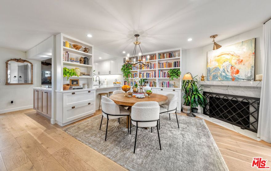 Stunning Designer Townhome, Full Custom Remodel in the Heart of Santa Monica. Discover this stunning and luxurious 3-bedroom, 2.5-bath designer townhome, fully reimagined with a complete custom remodel. Every inch has been thoughtfully curated with high-end finishes, blending modern elegance and functionality in a way that feels like your own private single-family home. Set within the esteemed Santa Monica-Malibu School District (Roosevelt Elementary, Lincoln Middle, and Santa Monica High) this residence is part of a charming, well-maintained, and lushly landscaped 7-unit complex with low HOA dues. Ideally located on a tree-lined street, you'll enjoy walkable access to all of Santa Monica's best offerings: boutique shopping on Montana, dining on Wilshire, Reed Park, Piper Preschool, the Fairmont, Rustic Canyon, Santa Monica Seafood, and of course, the Pacific Ocean just moments away. Inside, no expense was spared. The home showcases stunning hardwood floors, a gourmet custom kitchen with Bosch appliances, extensive built-in custom cabinetry, and sophisticated luxury lighting throughout. Spa-inspired bathrooms, two cozy fireplaces, and a library-style dining room add both comfort and character. With over 1,500 sq. ft. of living space, natural light floods through the home, highlighting its seamless indoor-outdoor flow. Multiple outdoor retreats invite year-round enjoyment of the coastal breeze including a private rooftop deck with sweeping city and mountain views, and additional patios with pet-friendly turf and upgraded drainage. The attached, direct-entry two-car garage features epoxy flooring and new custom storage cabinetry, making organization effortless. Outdoor storage cabinets and thoughtfully designed spaces add even more convenience. This rare townhome embodies the very best of Santa Monica coastal living: designer craftsmanship, a walkable beachside lifestyle, and a tranquil retreat in the heart of the city. Highlights: Full custom remodel with designer finishes throughout. Bosch high-end appliances & gourmet kitchen with custom cabinetry. Luxury lighting fixtures & extensive built-ins for maximum storage. Two fireplaces and over 1,500 sq. ft. of light-filled living space. Private rooftop deck with mountain & city views. Direct-entry 2-car garage with epoxy floors & built-in cabinetry. Located in the Santa Monica-Malibu School District, minutes to Montana Ave., Wilshire, Reed Park, brand new Equinox gym with rooftop pool, new Vons, Promenade, The Proper Hotel, and the beach
