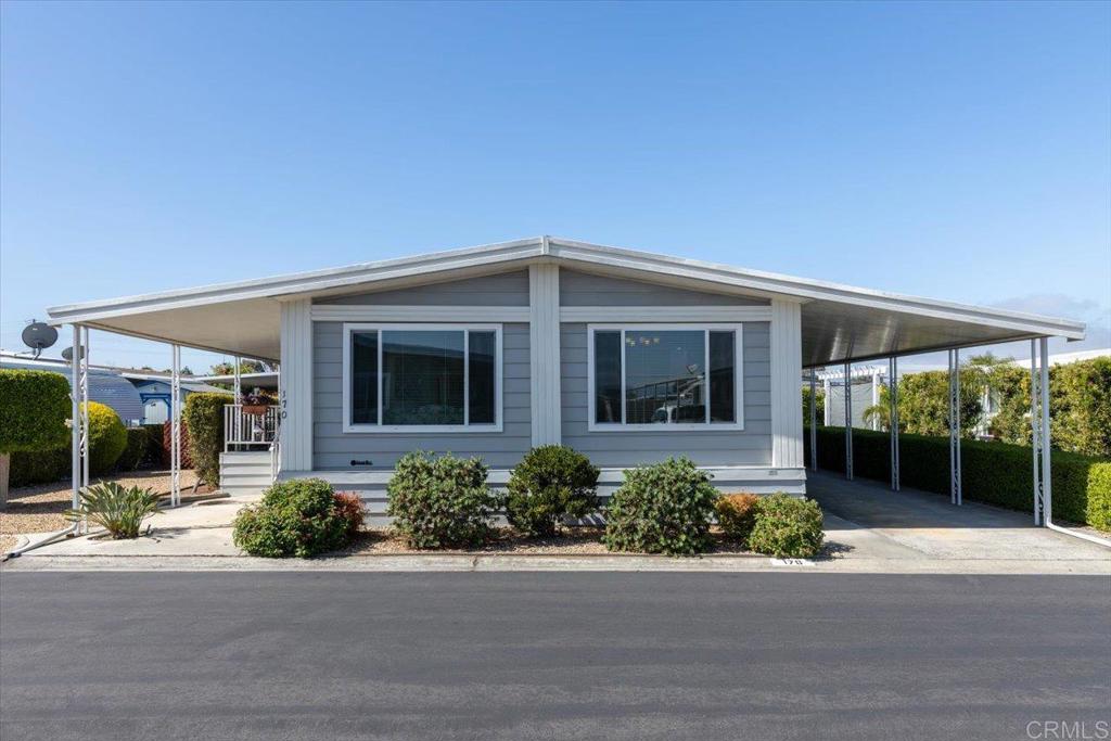 2 bed / 2 bath located in a 55+ rent controlled park with NO property taxes (home is still on HCD registration) This home boasts fresh interior paint and thoughtfully added recessed lighting, making the interior feel light, bright, and freshly updated. The windows and flooring were replaced in approx. 2018. Roof was replaced in approx. 2010. There are separate Living and Family rooms, plus an office desk nook. The Primary Suite boasts double sinks, a walk in closet, and seperate step in shower and soaking tub. Some of the furniture is available if desired! Check out the spacious wood deck and large covered raised porch, each provide lovely spaces for entertaining and relaxing. The yard also boasts an orange tree and two storage sheds! Palomar Estates East is a very active and social 5* community - check out the photos to see some of the amenities this community has to offer! Convenient to shopping, restaurants, Lake San Marcos, two golf courses at Lake San Marcos, another golf course nearby off Twin Oaks, entertainment, lots of parks and trails, the San Marcos Senior Center, and just a short 8 mile drive to Carlsbad beaches! Monthly space rent is only $635.65 and is under rent control!