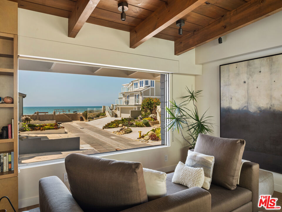 Laid-Back Luxury by the Sea: This is the one, the beach pad you've been dreaming of! One-story, ocean views, totally dialed. Start your day with a barefoot stroll on the sand, cruise home to rinse off in the steam shower, and cue up a sunset movie on the 110" projector. With skylights that open to the sea breeze, indoor-outdoor sound, and two fireplaces (one for late-night hangs outside), this place was made for the coastal rhythm. French oak and concrete floors keep it cool, while a Viking range and built-in BBQ bring the heat. Tucked into a chill, neighborly street with nothing but good vibes and salty air. "I'm pickin' up good vibrations." - Beach Boys