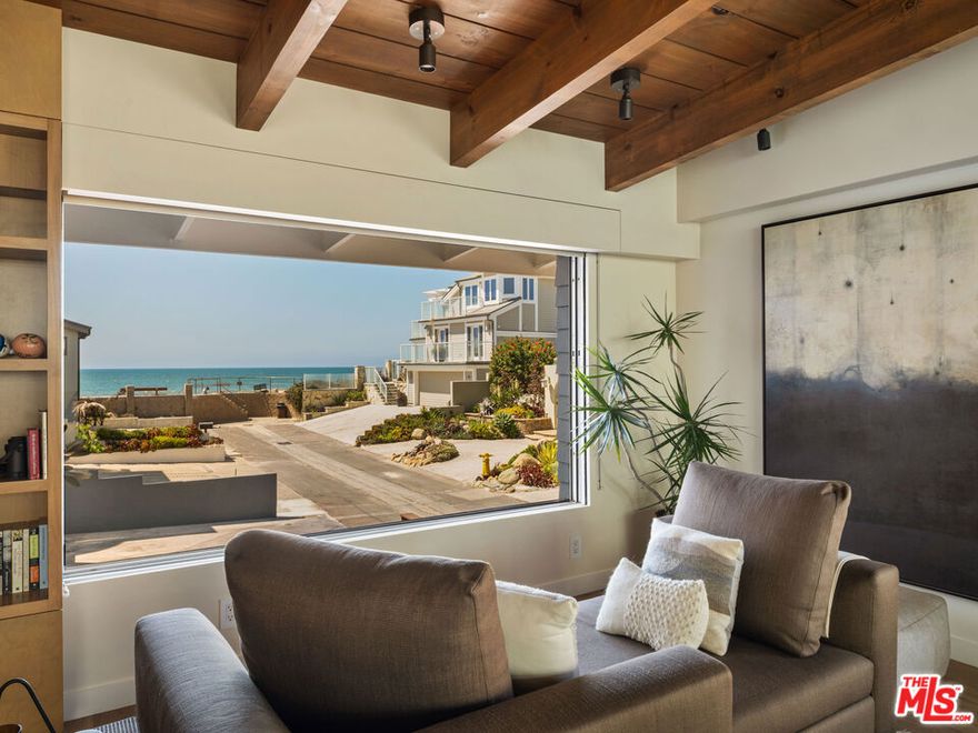 Laid-Back Luxury by the Sea: This is the one, the beach pad you've been dreaming of! One-story, ocean views, totally dialed. Start your day with a barefoot stroll on the sand, cruise home to rinse off in the steam shower, and cue up a sunset movie on the 110" projector. With skylights that open to the sea breeze, indoor-outdoor sound, and two fireplaces (one for late-night hangs outside), this place was made for the coastal rhythm. French oak and concrete floors keep it cool, while a Viking range and built-in BBQ bring the heat. Tucked into a chill, neighborly street with nothing but good vibes and salty air. "I'm pickin' up good vibrations." - Beach Boys