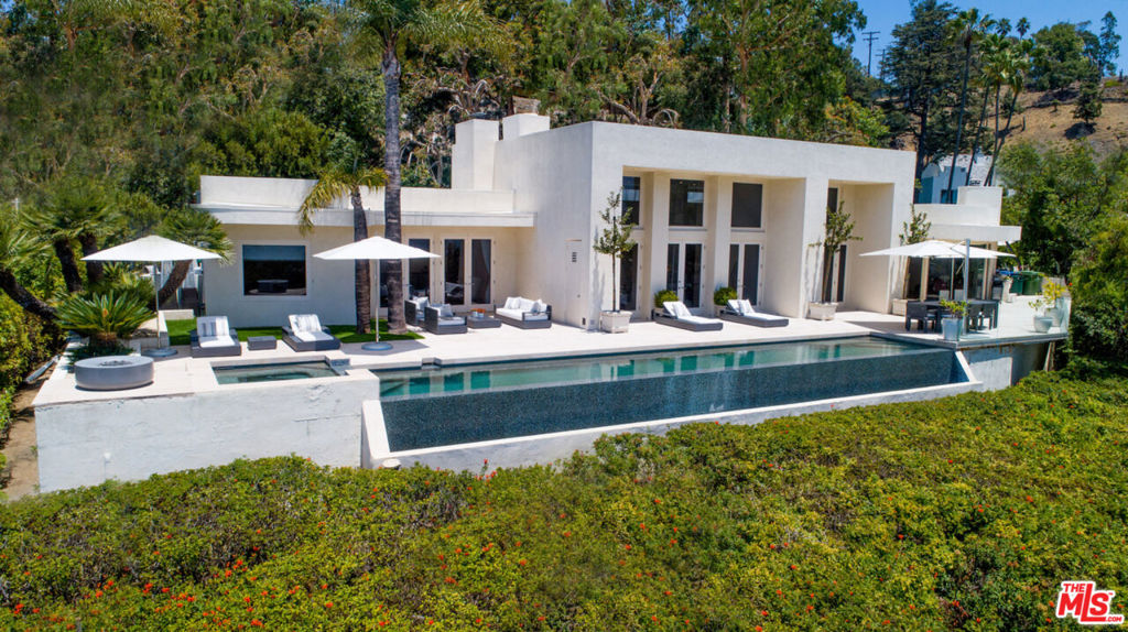 Walled and gated compound on approximately one acre promontory with unobstructed city and ocean views. The contemporary estate with walls of glass has been meticulously maintained. There are also plans for a 12,000 estate designed by famed architect Paul McClean. The existing contemporary home has walls of glass overlooking an infinity pool and spa. The public rooms incorporate high ceilings creating great volume. The primary bedroom, with sitting room/office, has a luxurious bathroom and large walk-in closets. There are two additional bedroom suites, an eat-in kitchen, family room, and powder room. Designer finishes throughout along with state of the art electronics/security system and so much more.