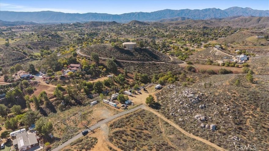 Great land opportunity on a private street. Near the highway and fwy 15. This land has water and electricity (per owner)
adjacent land also for sale. Ready to build a ranch casita and store a lot of toys. Nice flat lot with slight slope.  Buyer to 
investigate for buildability and feasibility with City Planning and/or Building and Safety
Adjacent parcel also for sale