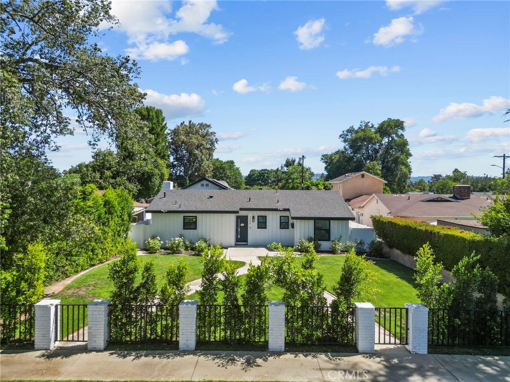 Completely remodeled Lake Balboa farmhouse with modern upgrades and timeless style. This 4-bed, 3-bath home offers 2,162sqft. of living space on a 9,418sqft. lot. Step into a bright open floor plan featuring a new kitchen with stainless steel appliances, oversized island, farmhouse sink, and all-new cabinetry. A spacious dining area with fireplace flows into the living room with sliding doors to the backyard.
Updates include a heat pump for year-round comfort, tankless water heater, solar panels, built-in dressers and closets, and new lighting and floors throughout. Bedrooms and bathrooms showcase modern finishes with high ceilings and skylights adding abundant natural light.
Enjoy a large backyard with a patio, deck, and well-kept lawn — perfect for entertaining or relaxing. Additional improvements: new roof, new plumbing, fresh paint, and stucco. Detached garage offers ADU potential. Conveniently located near shops, dining, schools, and easy access to 405 and 101.
This move-in ready home is a rare find — schedule a showing today!