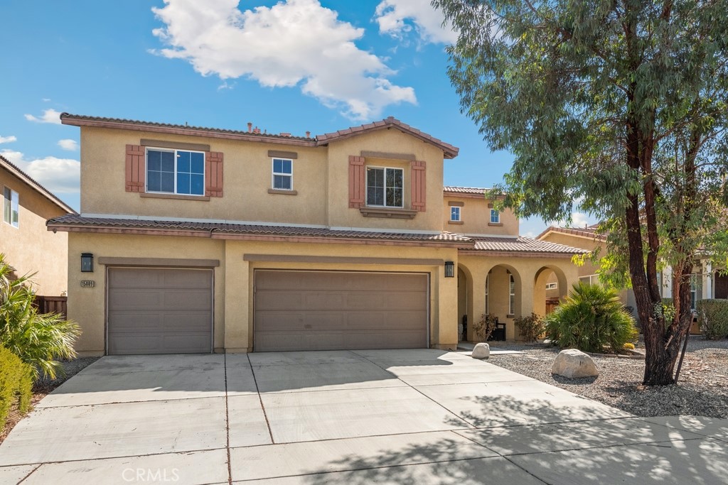 WELCOME TO THIS BEAUTIFUL HOME READY FOR A GROWING FAMILY! This is an exceptional home that offers comfort, convenience, and lifestyle seamlessly. It has been beautifully maintained and is ready for a growing family, as it has four (4) bedrooms, 2 & 3/4 bathrooms, with one bedroom and a ¾ bathroom conveniently located downstairs for family and guests. Upstairs has three bedrooms and two bathrooms. The primary suite has double sinks, a soaking tub, and walk-in closet. An enclosed huge loft currently used as a Gym, could be a theater room, a 5th bedroom, or customized for your needs. The laundry room has a folding area. Beautiful dark laminate floor upstairs. Open floor plan that flows seamlessly to the modern kitchen with granite counter tops, plenty of beautiful dark designer cabinets, a breakfast bar, and a breakfast nook, and built-in cabinetry for extra storage. The spacious living room has a fireplace for those winter nights. Go outside to a large, covered patio perfect for entertainment and a big yard ready for your imagination. Three (3) car garage with a working bench and an efficient Tankless water heater. This is a must-see to appreciate! Schedule your private tour today before it is gone!