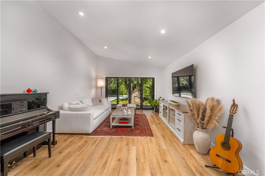 Beautifully updated 3BD/3BA contemporary ranch-style home located south of Ventura Blvd in prime Woodland Hills, featuring an open floor plan with tile floors, recessed lighting, and a bright living/dining area that flows seamlessly to a private backyard with a sparkling pool, perfect for entertaining. The remodeled kitchen boasts granite counters, stainless steel appliances, and breakfast bar seating. The spacious primary suite includes vaulted ceilings, a walk-in closet, and ensuite bath with dual sinks. Two additional bedrooms offer flexibility for guests or home office use. Gated front yard, mature landscaping, and serene eucalyptus tree add to the charm. Close to Ventura Blvd shops, restaurants, and easy access to Topanga Canyon and the 101 freeway.