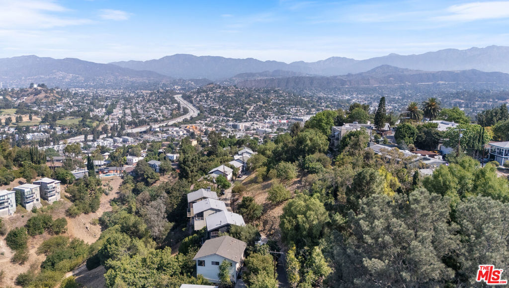 Views!!!! City-approved geology and preliminary plans included. Comps on the same street and within a 1/4 mile radius range from $1.2M to $1.9M. Situated in prestigious Glassell Park, this hillside property enjoys paved street access, public sewer in close proximity, and spectacular vistas including sweeping sunsets over Downtown L.A. and Griffith Park. Set within a peaceful, lush enclave, you're steps away from Elyria Canyon Park's scenic trails, the serene Rio de Los Angeles State Park, and the Frogtown bike-pedestrian bridge. The neighborhood thrives with quaint cafes, independent businesses, and craft-oriented charm, yet remains highly connected to Glendale, Eagle Rock, and Mount Washington with convenient transit and freeway access.