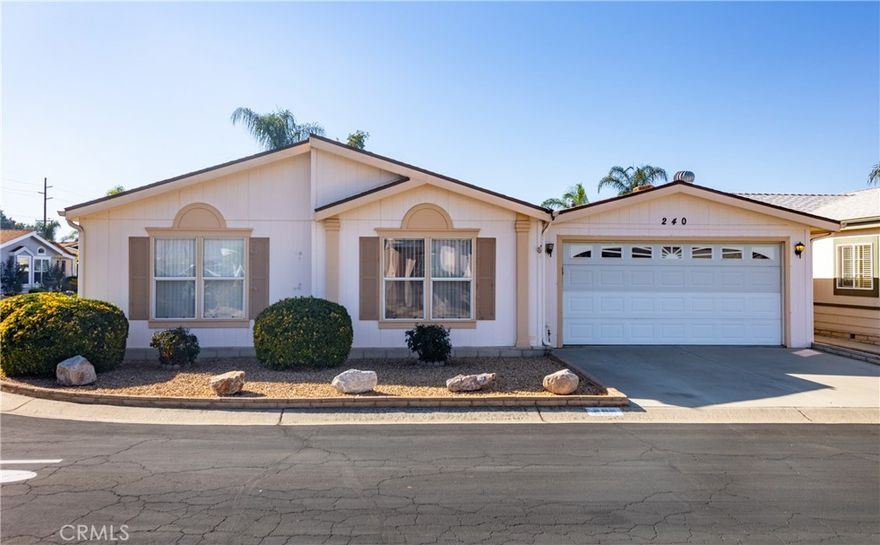 This 3 bedroom/2 bathroom home located in the desired senior gated community of Foothills of Hemet also has a permitted room off of the kitchen so there's lots of square footage. Large living room w/high ceilings opens up to the dining area and kitchen that has an island lots of cabinets & newer appliances. Primary bedroom is on one side of the home providing lots of privacy. The light & bright bathroom has double sinks, soaking tub & separate shower. Walk-in closet can be accessed from either the bedroom or the bathroom. The two guest bedrooms & a bathroom are at the other end. From the large additional room that would be be great for entertaining. From there you have direct access to the two-car garage and also the nice little covered patio. The park is clean, quiet, gated and just plain awesome with amenities including 2 swimming pools, spa, pickleball courts, air-conditioned shuffle board court, exercise room, recreation hall w/kitchen, and rooms to enjoy billiards, cards, bingo, crafts & fun planned dinners or activities. Ask about the park's RV parking area. Commuter friendly, and close to shopping & restaurants.