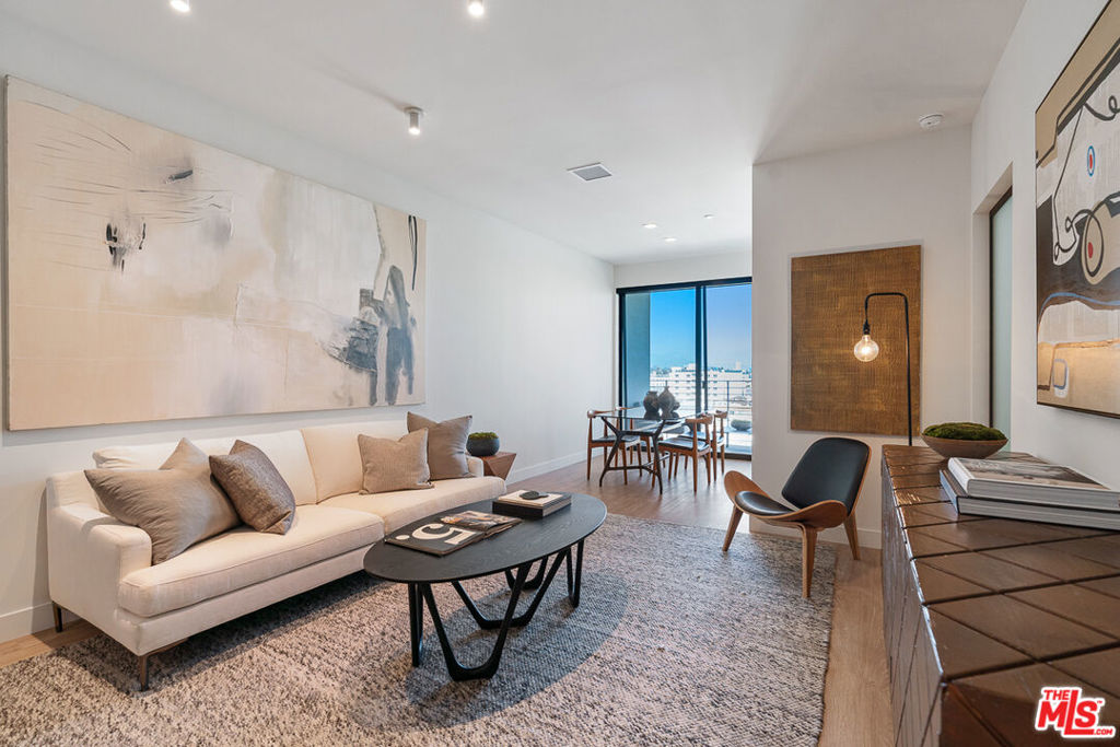 Venue Residences by Helio. This beautiful 1 bed + 1 bath is the A-layout available on the 4th floor, West facing. Kitchen has unique dark finishes with stained granite counters, matte black fixtures, and stainless steel Beko appliances. The open living and dining concept allow for a good flow of the space, as well as access to a large balcony for comfortable outdoor lounging. The bedroom has a large window, built in lighting and a remote controlled ceiling fan. From here you walk into the highlight of this layout which is the walk-through dressing room with beautifully custom made closets, a large built-in mirror, and adjustable lighting. The bathroom has ample counter space, a wall-to-wall mirror, standing shower with a rain shower head, separate bathtub, and a linen closet. Property amenities include: Fitness center, 2 rooftop lounges with heated dipping pool, co-working spaces, conference room and front desk staff. Parking is $150/month for a single space, and internet $84/month. Please note photos are not of exact unit; views will vary. Tours are available by appointment, so please contact us today.