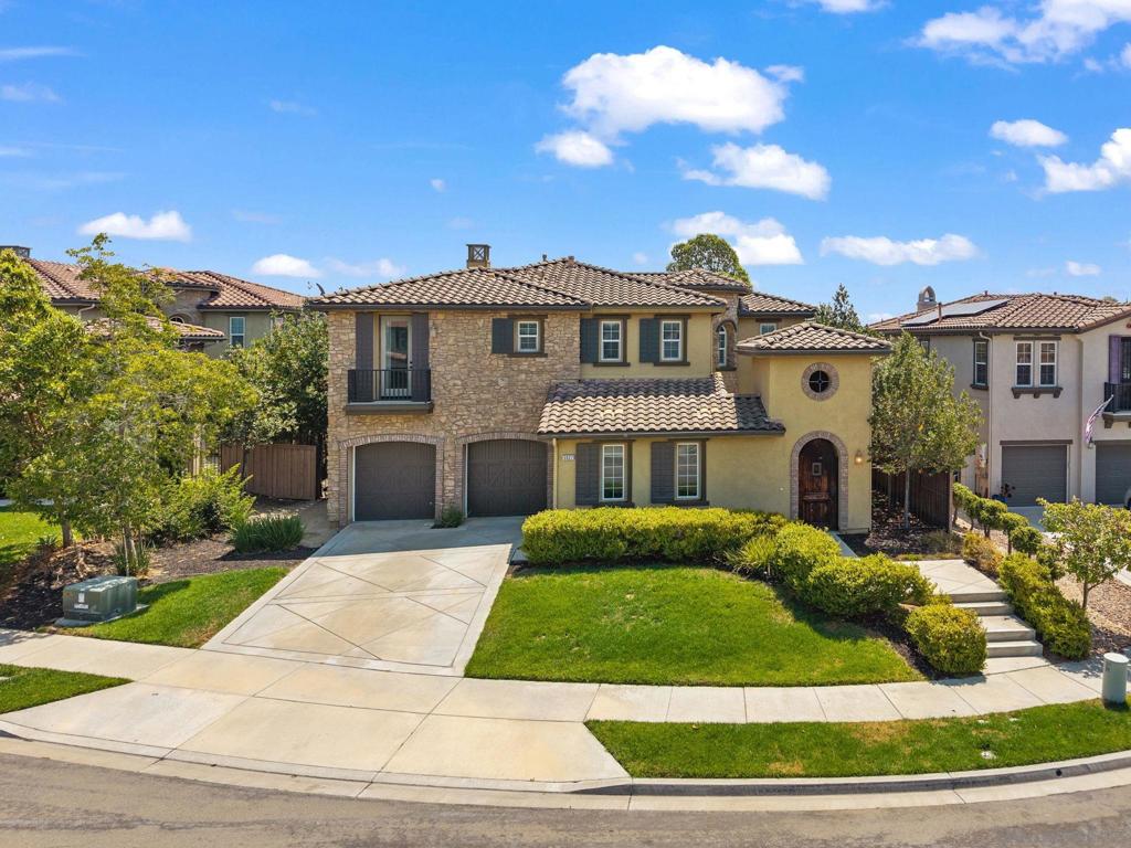 Nestled on a quiet cul-de-sac in Oceanside, 5527 Alexandrine Ct offers a rare blend of space, privacy, and sophistication. This 5-bedroom, 4-bathroom home spans 4,057 sq ft on a 10,000+ sq ft lot, with views of rolling hills and abundant natural light. Formally one of the community's model homes, the open-concept layout features an oversized kitchen island and expansive living and dining areas. A desirable first-floor bedroom provides flexible living options for guests or multigenerational needs. The luxurious primary suite includes dual walk-in closets, a jacuzzi tub, and a double vanity. With a large, private backyard and a thoughtfully designed interior, this home is ideal for both everyday living and entertaining. Additional highlights include a 3-car garage and close proximity to top schools, parks, shopping, and beaches.
