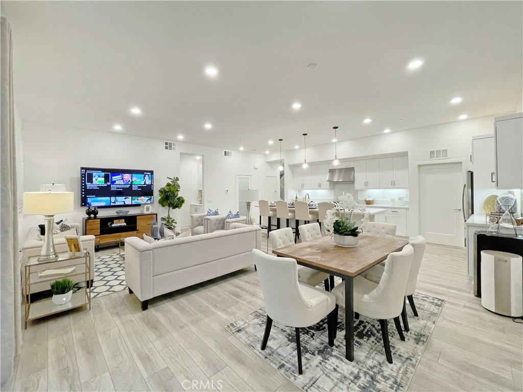Experience elevated living in this beautifully upgraded corner unit within the sought-after Levity community at Tustin Legacy. Spanning 2,183 sq. ft., this light-filled residence offers some of the community’s best views of the park and The Hangar. Beautifully designed, this home offers 3 bedrooms and 3 bathrooms. The first floor features 2 bedrooms, including the primary master suite with a private bath, dual sinks, and a spacious walk-in closet, perfect for guests or extended family. The second floor hosts the third bedroom, a private suite with its own bath and walk-in closet.
Additionally, on the third floor you will find the dining area that flows effortlessly onto a covered balcony with sweeping views. Lots of natural lighting throughout the home! The chef’s kitchen is both stylish and functional, complete with quartz countertops, stainless steel smart appliances, a walk-in pantry, and a spacious center island with bar seating. The third-floor deck offers the perfect spot to relax or entertain while taking in vibrant sunsets. Additional highlights include a two-car garage, designer finishes throughout, and access to resort-style amenities such as a pool, spa, BBQ area, and Victory Park. Located just minutes from The District at Tustin, top-rated schools, shopping, and dining, this rare lease opportunity combines modern comfort with an unbeatable location.