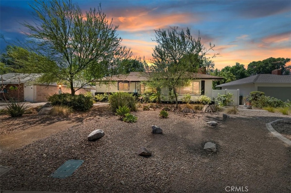 Step into timeless charm with this 1952 Mid Century Ranch nestled in the highly sought after Wood Streets neighborhood. Featuring 2 bedrooms and 1 bathroom, this home is filled with stunning original details that showcase its classic character. Enjoy cozy evenings by the fireplace, a bright and inviting living space, and a functional kitchen with appliances included. The large yard offers endless possibilities for entertaining, gardening, or simply relaxing under the mature trees, while the detached garage provides convenience and additional storage. Set on a picturesque tree lined street, this home blends vintage style with everyday comfort in one of Riverside’s most beloved neighborhoods.