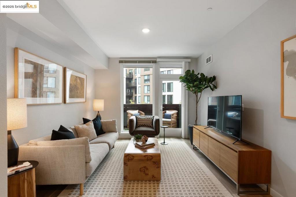 Now Selling at Caspian Residences at Brooklyn Basin - Discover modern waterside living in this thoughtfully designed 1-bedroom, 1-bathroom condo with a balcony, spanning approximately 621 sq ft. Located in one of Oakland’s most exciting new communities, this home offers a rare chance to own in a vibrant, amenity-rich setting. The open layout features sleek finishes, a well-equipped kitchen with Samsung stainless steel appliances, quartz countertops, and modern cabinetry. High-efficiency dual-pane windows frame the bright living area, while the bathroom includes quartz counters and Grohe fixtures. Includes in-unit washer and dryer. Caspian residents enjoy landscaped courtyards, a game room, a fitness center, co-working spaces, and rooftop lounges with panoramic views. Situated on Oakland’s revitalized waterfront at Brooklyn Basin, the community provides direct access to parks, dining, and recreation, with Jack London Square, BART, and ferry service to San Francisco just minutes away. Residence 409 includes one parking space. Originally designed as apartments and professionally managed since 2023, Caspian is now offered as a limited collection of condominiums—already complete, established, and thriving.