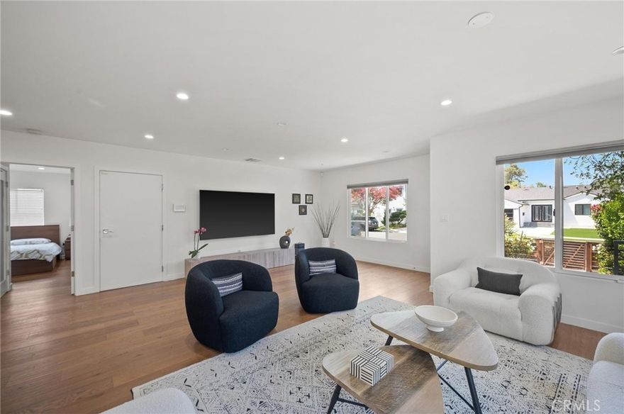 Welcome to this stunning home in the heart of Encino! Where contemporary design meets everyday functionality. This beautifully crafted residence offers a perfect blend of style, comfort, and convenience — ideal for buyers seeking a turnkey property with high-end finishes and generous outdoor space. Step into an open floor plan flooded with natural light, featuring gorgeous hardwood floors, high ceilings, and recessed lighting throughout. The modern kitchen is a chef’s dream, equipped with stainless steel appliances, sleek cabinetry, and direct access to the large backyard — an entertainer’s paradise perfect for weekend barbecues, outdoor dining, or simply relaxing in your own private oasis. The bathroom's boast custom tile flooring in the bathrooms, with elegant shower-in-tub combinations for a spa-like experience. Convenient in-kitchen laundry adds ease to your daily routine, while the well-sized bedrooms provide comfort and space to unwind. Every detail of this home has been thoughtfully designed, making it the perfect blend of functionality and luxury. Located just minutes from Ventura Blvd, you’ll enjoy easy access to shopping, dining, parks, and major freeways — all while living in a peaceful residential pocket of Encino. Whether you’re a first-time buyer, a growing family, or simply looking for a modern space with plenty of room to entertain, this is a rare opportunity you don’t want to miss. Schedule your private tour today and experience the best of Encino living!