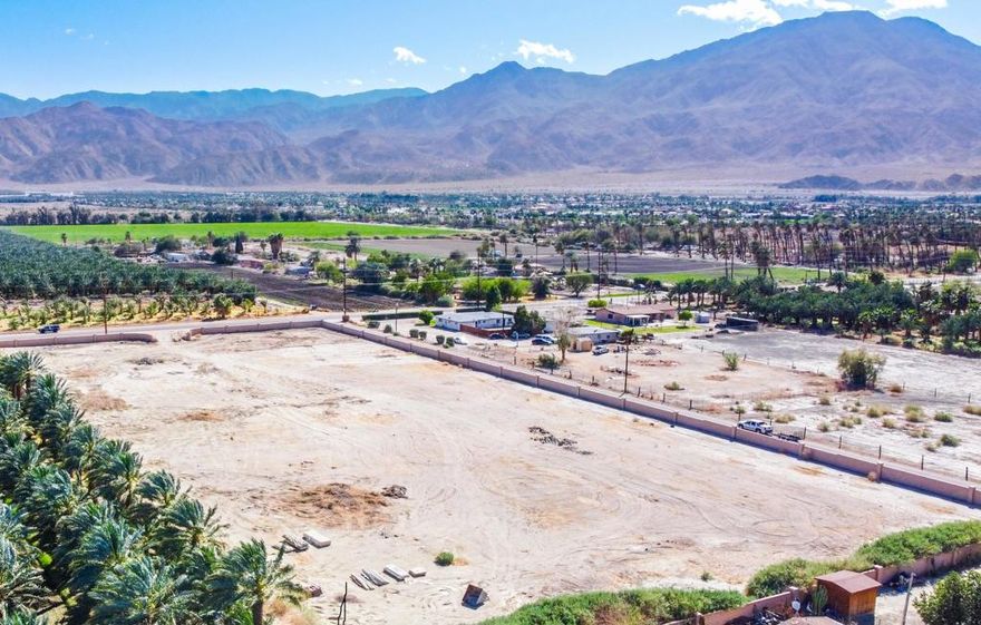 This 4.77-acre parcel is the perfect place to create your dream equestrian ranch or a family compound, with one or two houses,  on level land that has been cleared of brush.  The mountain views are breath =-taking.  Its quiet and in a rural area.  Yet, it's located about 10 minutes from Ralph's shopping center located at 50th and Jefferson. It's near several prestigious clubs, such a Madison Club,  Andalusia CC and Rancho Polo Equestrian Club. Its also approximately 8 minutes away from (Jacqueline Cochran/Thermal Airport - Private). It is located on a street corner . It fronts on two paved streets, with a handsome block wall encircling the entire site that's already built - on all four sides. It's Zoned A120. It has Electricity Service and Sewer Service that are both available for connection. A water well is allowed and the water in the area has been proven to be good potable/drinkable water. This parcel does not have a water well at this time.  Low-cost Agricultural Water is also available - not drinkable yet great for irrigation. This information is deemed reliable, however, not guaranteed.