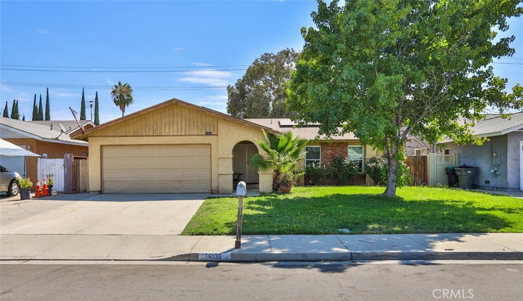 Single family, single story home sitting on 8712 square foot lot! Nice curb appeal with lush green lawn, mature landscaping, and a covered/arched entryway! Features include: Solar panels installed in 2018, and Windows, Furnace, AC, & water heater were upgraded/updated too! Spacious rooms including the Kitchen which is open to the living room! Primary bedroom and bathroom, plus a 2nd bedroom & full bathroom! HUGE back yard with plenty of room to spread out with block walls along the back, and newer vinyl fencing on one side too! Great location not far from the 215/60 freeways, Lake Perris Recreation area, March Airfroce Base, Kaiser, Shopping, Restraunts, and more!