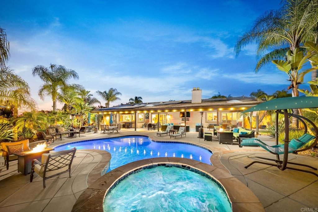 Where Resort Living Meets Rural Serenity Stunning Entertainer’s Dream Home on 2.48 Acres with Saltwater Pool, Panoramic Views & Room to Grow Welcome to your personal resort a one-of-a-kind retreat where luxury meets comfort and every detail is designed for effortless entertaining and everyday indulgence. With over 200K in recent upgrades this beautiful single-story home offers the ultimate indoor-outdoor lifestyle. The heart of the home is a chef’s kitchen that will take your breath away, featuring a massive 9-foot island with prep sink, custom red oak cabinetry, granite countertops, stainless steel appliances, double sinks, trash compactor, and an incredible 6-burner, 40” commercial-grade gas stove. Skylights flood the space with natural light, creating a warm and inviting ambiance. The open-concept design flows seamlessly into the spacious dining and great rooms, where soaring ceilings and a large slider open directly to your backyard oasis perfect for hosting guests while staying connected to the action. The primary suite is a serene escape, complete with a cozy gas fireplace, patio access, generous walk-in closet, and a spa-inspired bath with dual vanities, a walk-in shower, and a luxurious soaking tub. The home's split layout ensures privacy, with two additional bedrooms and a flexible optional 4th bedroom or office on the opposite side. Step outside and experience true resort living. The 60-foot covered patio with ceiling fans, skylights, and a built-in speaker system overlooks your saltwater pool, panoramic views, and lush landscaping. Unwind in your outdoor shower, or entertain beneath the stars. With 2.48 flat, usable acres, there’s room to bring your vision to life whether that means a barn, horse arena, workshop, ADU or JADU, or your own private family compound. Additional Upgrades & Features Include: Owned solar system (41 panels) energy-efficient & eco-friendly. Oversized 4-car garage with insulated doors. Dual-zoned HVAC and two water heaters. Plantation shutters, crown molding, and fresh interior paint throughout. WIFI-controlled AquaLink pool system and landscape irrigation. ADT alarm system and Lorex security cameras. Landscape enhancements: palm trees, fruit trees (apple, orange, plum, peach), garden boxes, rock accents, vinyl fencing with chain link. New Bosch dishwasher, 43 LED can lights, new electrical outlets, and more. From the peaceful views to the thoughtful upgrades, this home has been lovingly cared for and meticulously enhanced. If you’ve been dreaming of resort-style living with the freedom of country space, this is your moment.