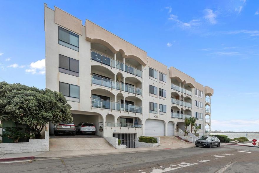 Live Steps from Sail Bay in Pacific Beach! Experience coastal living at its finest in this condo with direct beach and spa access. The stunning kitchen features sleek stainless steel appliances, quartz countertops, and abundant cabinet space and an in-unit washer/dryer combo for convenience. Enjoy vinyl waterproof flooring throughout and custom-built closets in both bedrooms. The beautifully updated bathroom includes a double vanity, herringbone subway tile, and a modern glass-enclosed tub/shower. Elegant shaker doors and premium LED lighting. Relax on your private balcony and take in the serene water views — the ultimate beachside retreat!
