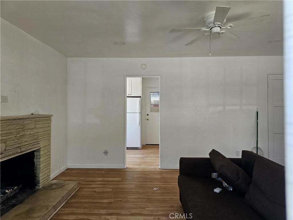 Super quaint rear unit in adorable 1950 era duplex. This charmer has been lovingly cared for and maintained and received an upgraded kitchen a couple years ago. Luxury vinyl wood plank floors accent the fireplace stone and charming French pained windows compliment the space well. the bath and kitchen have been moderately upgraded and there is a small dining alcove in the kitchen as well. The kitchen side door leads to the rear door of the single car garage for private access to the home. There is a washer and dryer hook up in the garage as well. The rear yard offers a private place to sit and relax or BBQ all surrounded by a tall white picket fence. Extremely well located on the south side of PCH next to shopping, restaurants and the bluff top park overlooking the ocean nearby. Fashion Island and John Wayne airport (SNA) not far away either.