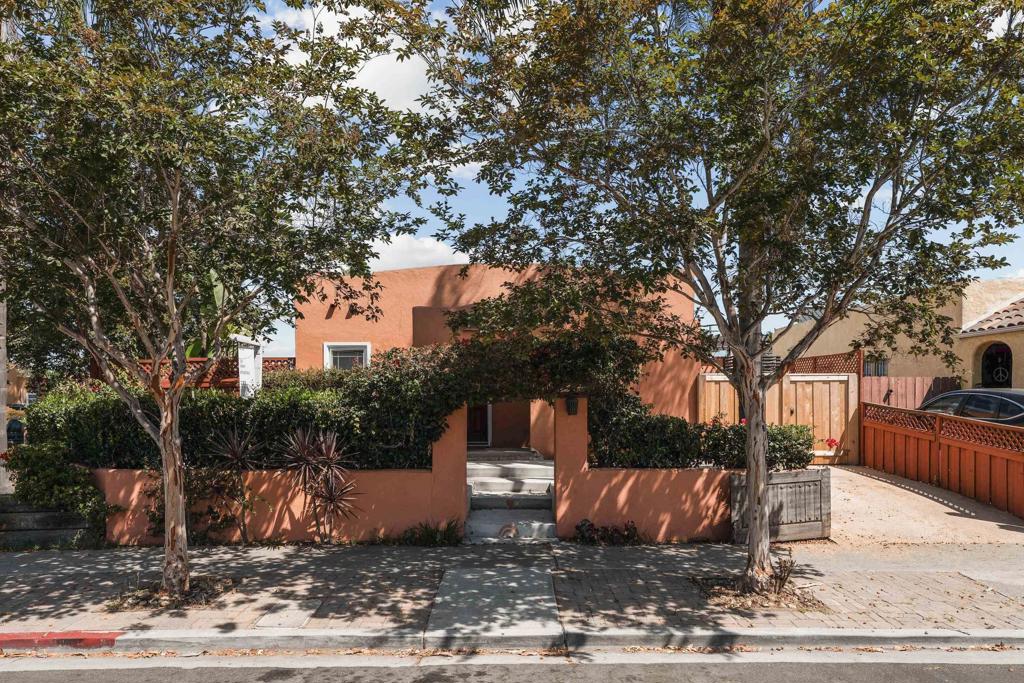 Welcome to 3262 Meade Ave, a classic 1920s Spanish-style home situated on a coveted corner lot in one of San Diego’s most vibrant neighborhoods. Rich in original character, from the arched entryways and coved ceilings to the original hardwood floors and decorative fireplace, every corner of this home tells a story. The home has been updated with modern electrical and plumbing systems, and A/C, blending historic charm with everyday functionality. French doors off the primary bedroom open to the backyard, creating an easy connection to the outdoors and offering a peaceful place to relax. The private backyard offers space to unwind, complete with an outdoor shower, perfect for rinsing off after beach days or bike rides, a detached garage for storage or creative use, and off-street parking for added convenience. Located just blocks from local cafés, parks, and the lively Adams Ave corridor, this is a rare opportunity to own a beautifully preserved piece of Normal Heights with timeless style and thoughtful updates.