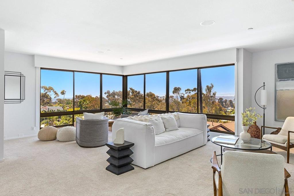 Stunning views, this boutique Bankers Hill mid-rise offers panoramic skyline, ocean and city views from downtown, Point Loma, ocean & bay (West view and Partial South protected) With the ever-expanding development in Bankers Hill, these features are becoming increasingly rare. This artfully and professionally remodeled (not investor flip) 3-bedroom, 2-bath home in historic Bankers Hill, offers custom and quality touches throughout. Steps from Balboa Park, the 7 Bridges walk, & some of San Diego's finest restaurants and coffee shops. Spanning 2,294 sq. ft. all on one level, it’s bright, spacious, and designed for effortless living. Inside you'll find a thoughtful & expansive floor plan with open living / dining and sitting are and office (third bedrooms) that are complimented with wraparound windows framing the skyline and bringing an abundance of lite & West breezes. Custom details along with elevated materials for the newly updated kitchen, bathrooms, laundry along with more subtle details in smooth textured walls, updated lighting and flooring and top of the line sound proofing added to the unit above. Retreat to the oversized primary bedroom with a newly updated oversized spa like bathroom and expansive walk in closet. The second spacious suite offers walk in closet with attached updated guest bath. Unique to the area, this property offers a large walk in laundry room which is the only shared wall additional storage and gated parking. Fully reimagined and updated, this is an exceptionally rare opportunity in the heart of Bankers Hill.