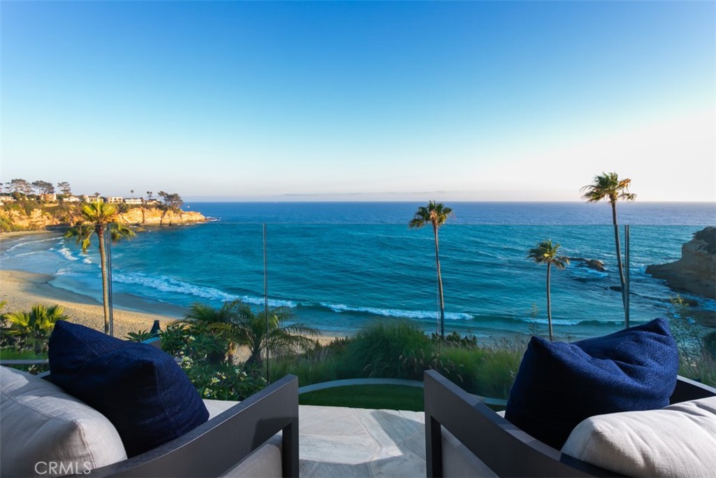 Nestled along the picturesque coastline of Laguna Beach, 26 S La Senda presents an exceptional opportunity to experience coastal living at its finest. This oceanfront masterpiece offers unparalleled panoramic views of the Pacific Ocean, with breathtaking sunsets and the soothing sound of the waves as your backdrop. Designed with meticulous attention to detail, this custom-built residence boasts four bedrooms and six bathrooms, all elegantly appointed to provide comfort and luxury. The open-concept living spaces flow seamlessly, with walls of glass framing the magnificent ocean views. The gourmet kitchen features high-end appliances and a spacious island, making it a chef's delight and an ideal gathering place for family and friends. Step outside to the multiple outdoor terraces and patios that invite you to savor the fresh sea air and relish in the California sunshine. Enjoy alfresco dining with views of Whale Rock and cinematic sunsets or relax in the spa while watching sailboats drift by. 26 S La Senda is more than a home; it's a sanctuary of peace and serenity offering direct access to a private community beach, a unique and rare feature in Laguna Beach. Experience the magic of this captivating oceanfront retreat, where you can relish in the ultimate in seaside luxury while still being in close proximity to Laguna's renowned art scene, dining, and shopping. This is a once-in-a-lifetime opportunity to own a piece of paradise on the California coast. Don't miss your chance to make 26 S La Senda your dream coastal retreat.