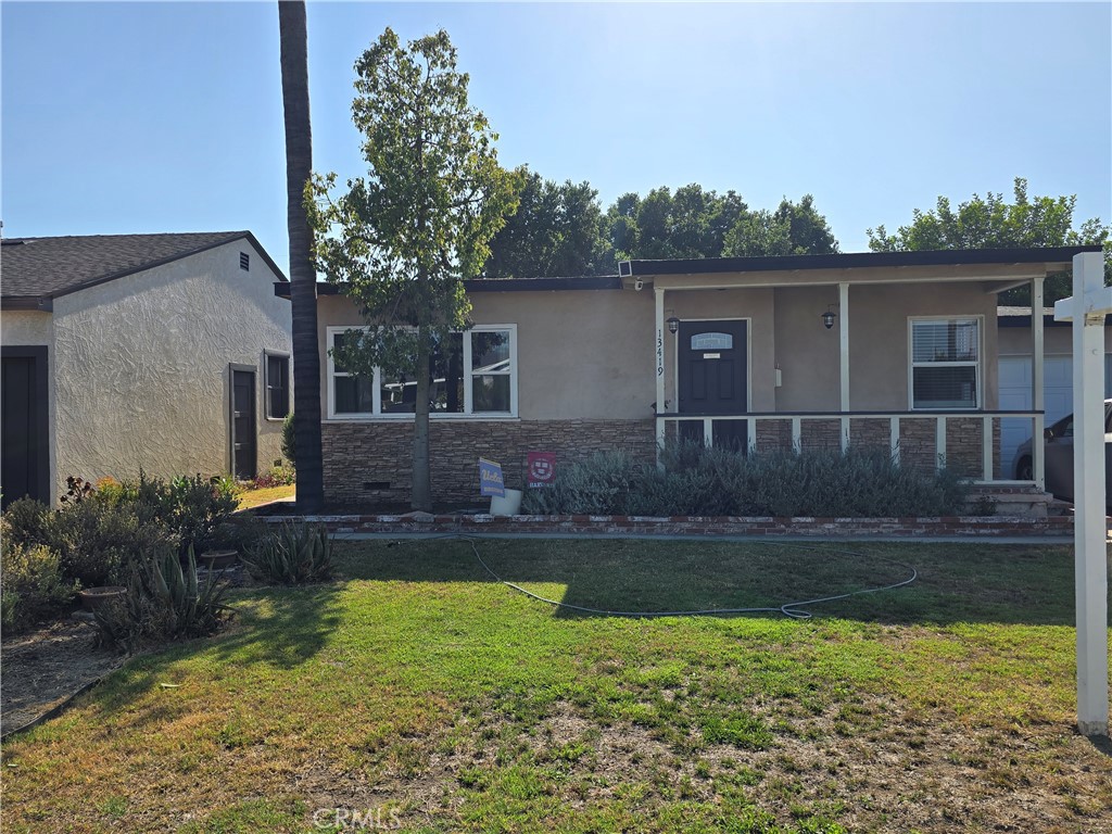 Beautifully maintained 3-bed, 2-bath home in a highly sought-after neighborhood. Features include original hardwood floors, crown molding, new laminate flooring in bedrooms, quartz countertops, remodeled bathroom, and a separate laundry room. Spacious backyard with concrete patio, apple tree, and storage shed. Conveniently located near Downey Unified schools, St. John Bosco High School, Thompson Park, and easy access to the 105 Freeway, SoFi Stadium, LAX, and more. Property sold as-is with no warranties, repairs, credits, or termite work. Buyer to verify all information and conduct their own due diligence. Do not disturb occupants.